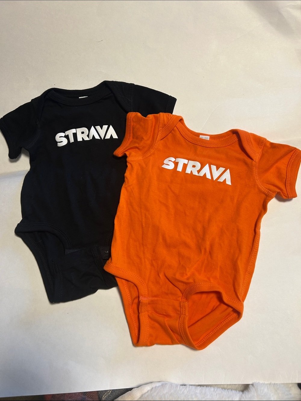 Lot of 2 Rabbit Skins Strava Logo Bodysuits in Orange and Black, size: 6 months